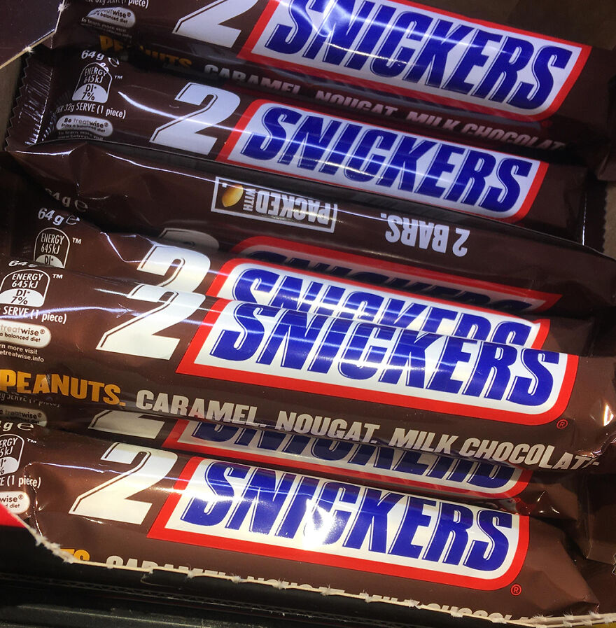 Snickers candy bars stacked together, showcasing one of the most popular Halloween candies in 2025 reader’s vote.