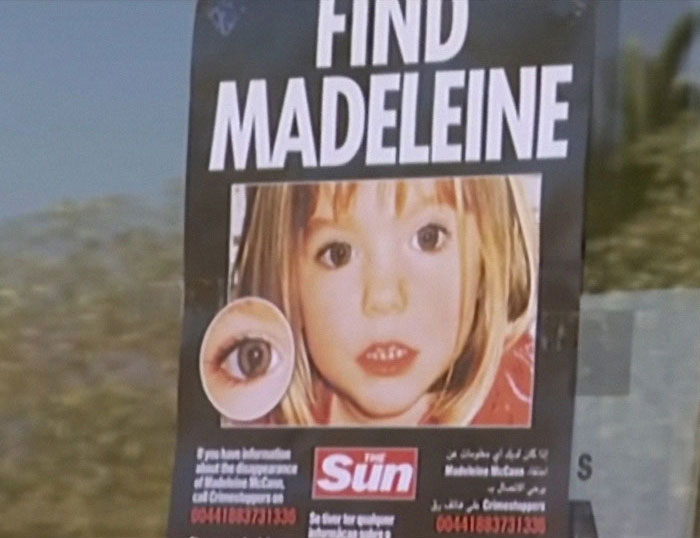 Missing person poster for Madeleine McCann with a close-up image and find Madeleine text displayed.