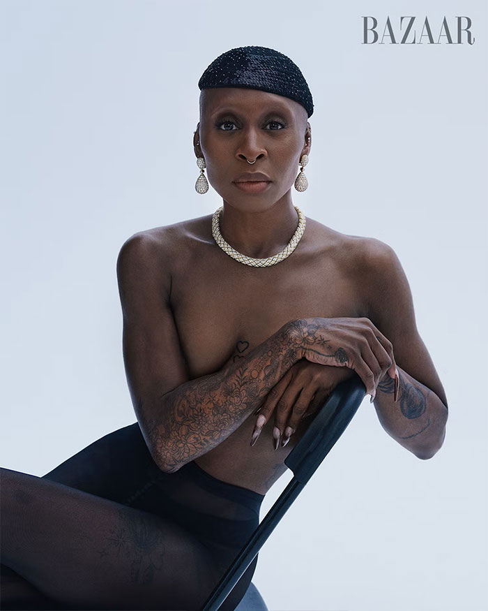 Cynthia Erivo posing topless with tattoos and jewelry in a striking and controversial Harper&rsquo;s Bazaar fashion shoot.