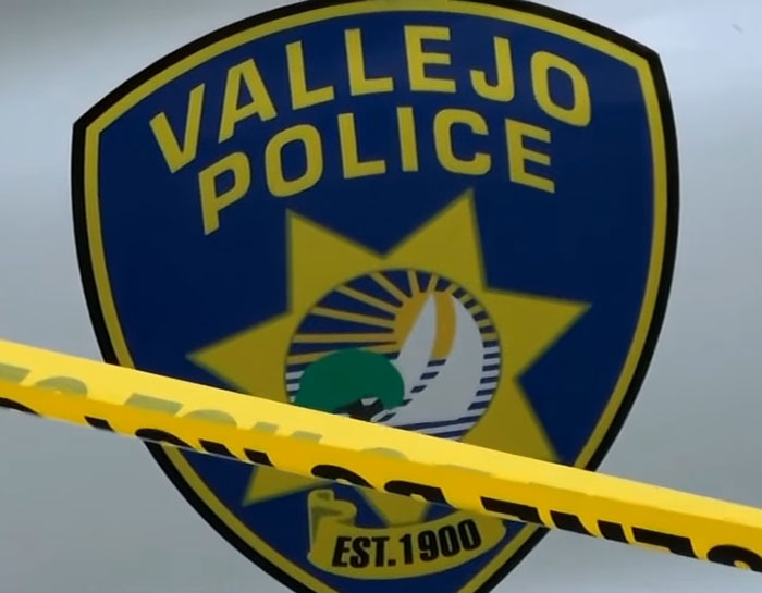 Vallejo Police badge behind yellow caution tape at a crime scene involving a hoarder's home investigation Vallejo Police badge behind yellow caution tape at a crime scene involving a hoarder's home investigation