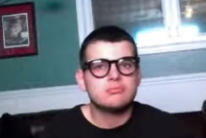 Teen driver wearing glasses in an indoor setting, connected to a fatal hit-and-run and possible adult trial.