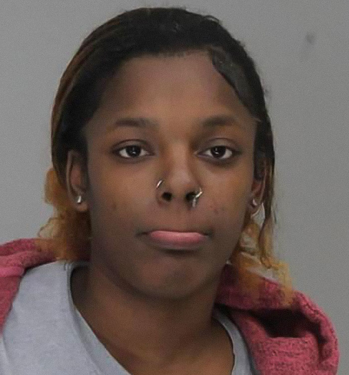 Mugshot of a woman involved in a fatal incident outside a pet store after argument over courtesy.