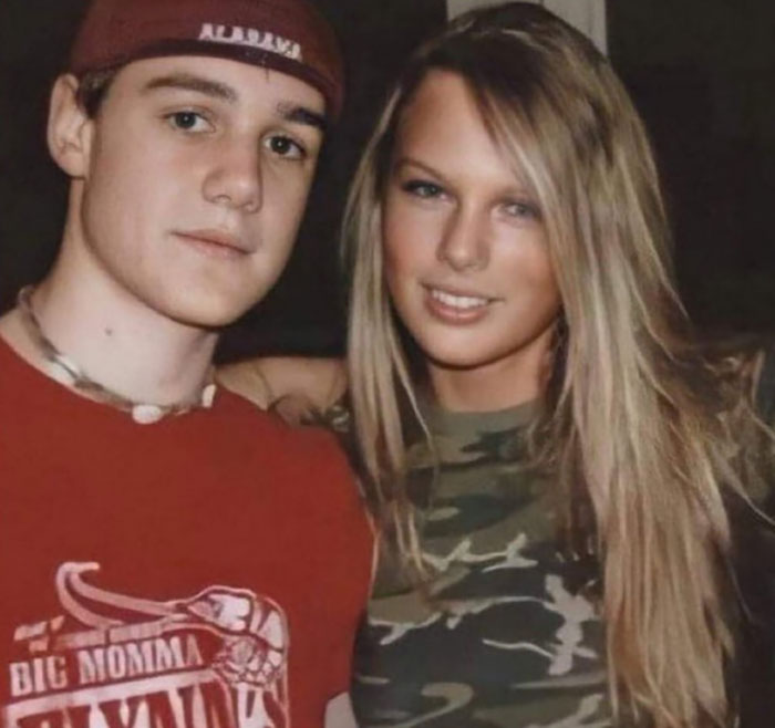Young man wearing Alabama cap and red shirt poses with woman in camouflage top, mom of late Taylor Swift friend breaks silence.