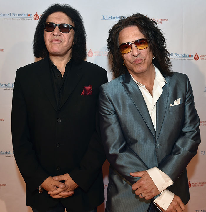 Gene Simmons and Paul Stanley posing together at an event, speaking on Kiss bandmate Ace Frehley&rsquo;s sudden passing.