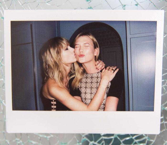 Taylor Swift and Karlie Kloss sharing a close moment, sparking lesbian relationship rumors after resurfaced interview slip.