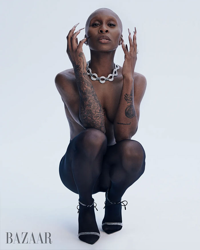 Cynthia Erivo posing in sheer black tights and heels with tattoos and jewelry in controversial Harper&rsquo;s Bazaar shoot.