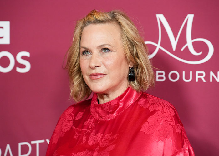 Celebrity dressed in red against a purple backdrop, illustrating the high cost of being famous and celebrity lifestyle expenses.