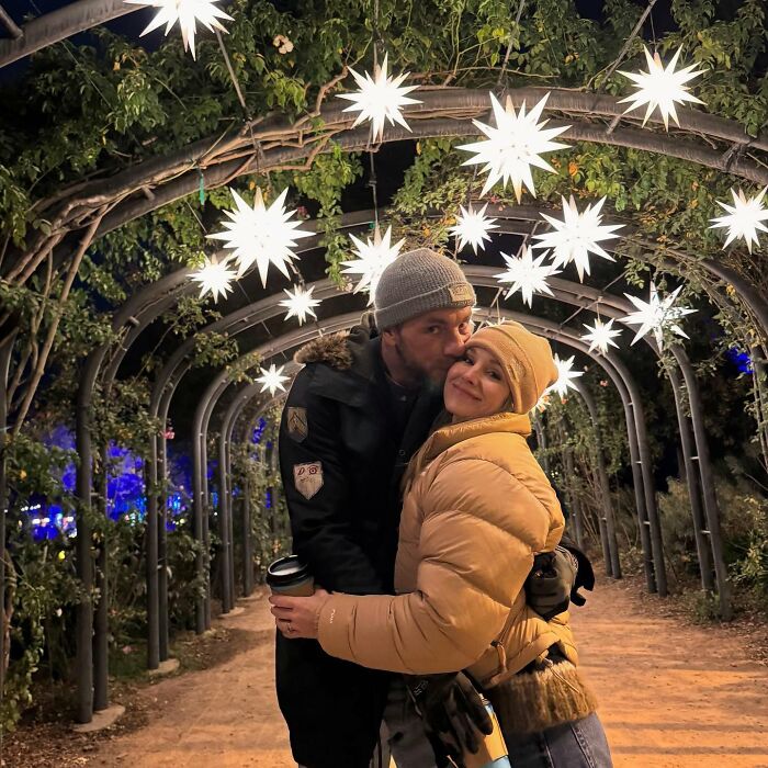 Couple embracing under star-shaped lights at night, highlighting Kristen Bell wedding anniversary post reactions.