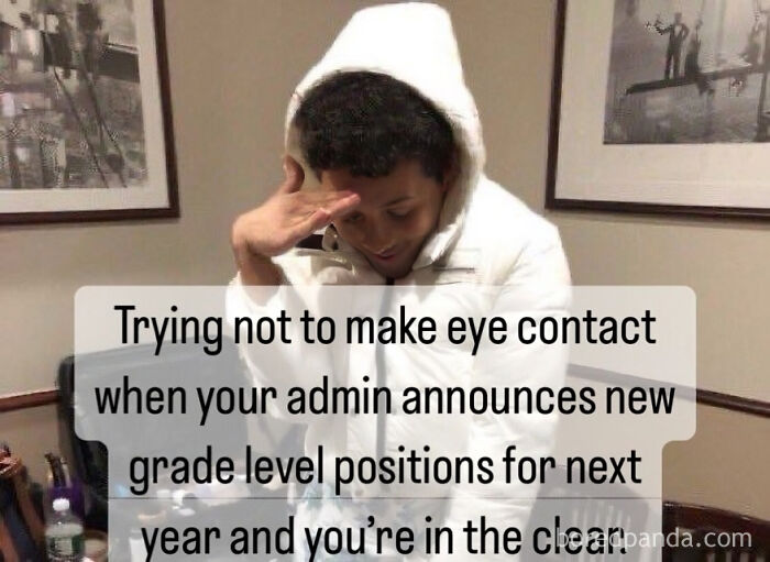 Person in white hoodie avoiding eye contact, illustrating a funny meme for teachers related to school admin and grade level positions.