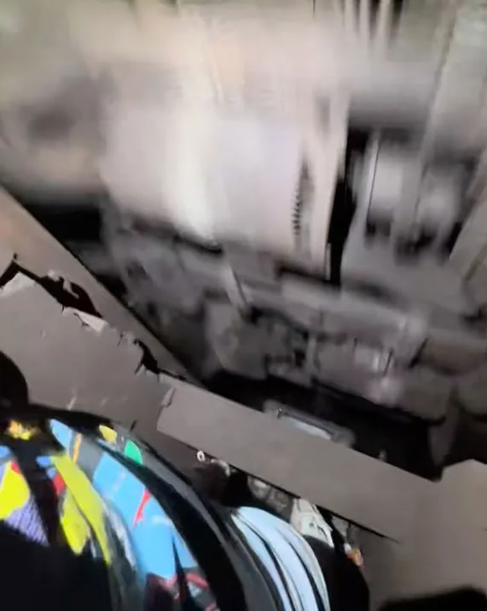 View from a person subway surfing beneath a moving train, relating to a 12YO who lost her life and posted videos online.