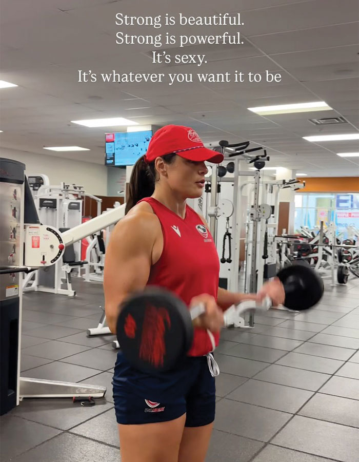 Olympic athlete Ilona Maher lifting weights in a gym, challenging the considered overweight stereotype with strength.