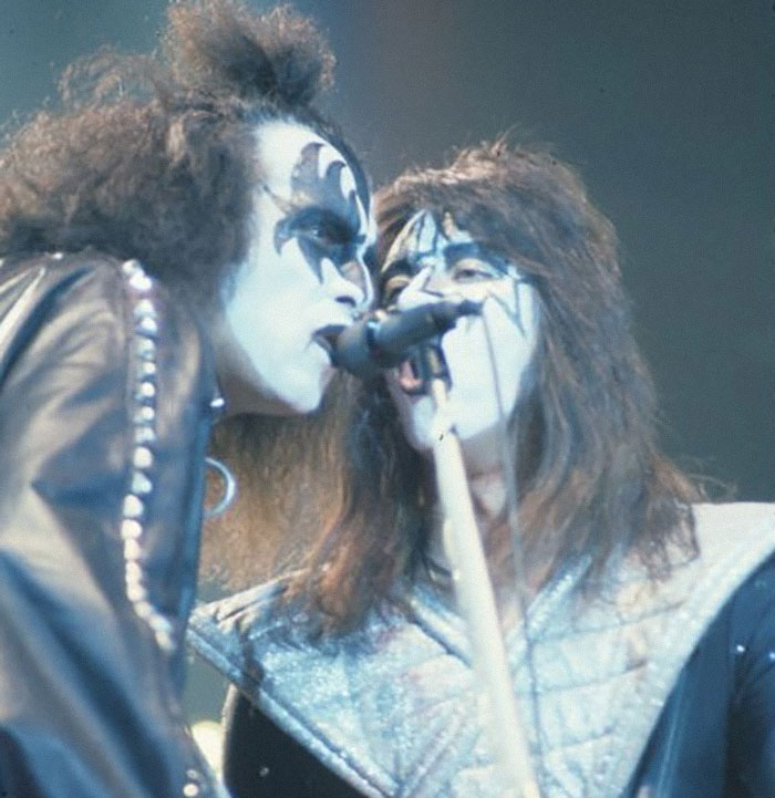 Gene Simmons and Paul Stanley of Kiss performing on stage with iconic makeup and costumes in a live concert setting.