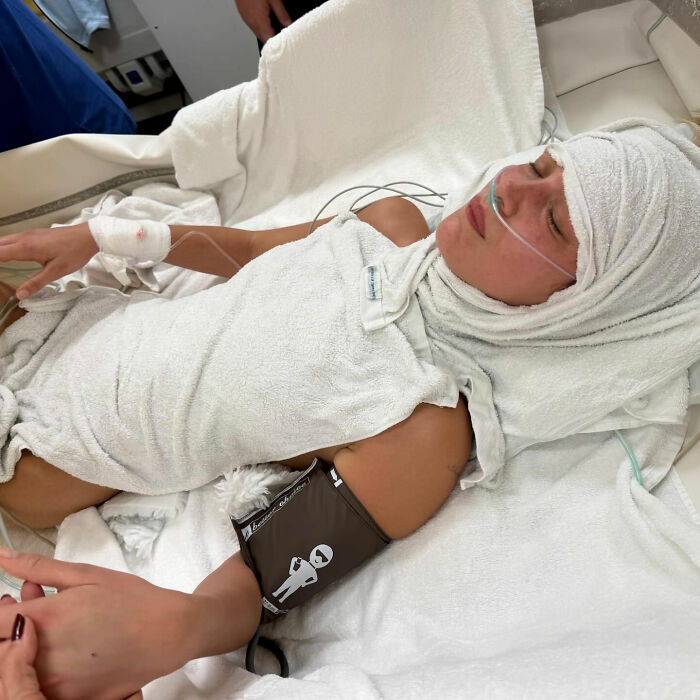 Bella Hadid resting with medical equipment, highlighting fans stunned by the weight of her Victoria&rsquo;s Secret angel wings.