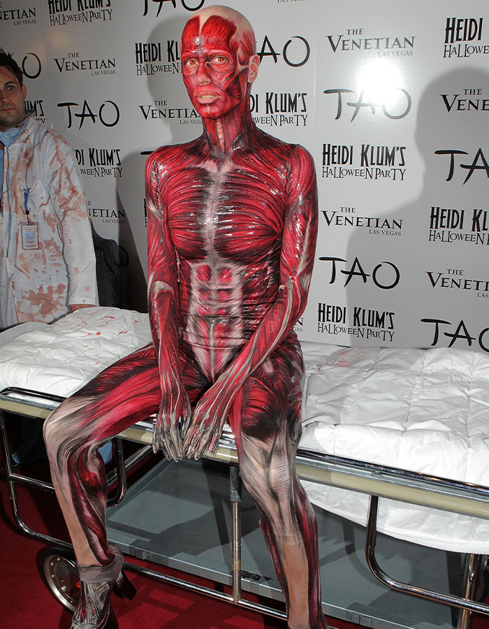 Person in a detailed muscle anatomy costume at Heidi Klum’s Halloween party, showcasing a nightmare-level 2025 outfit.