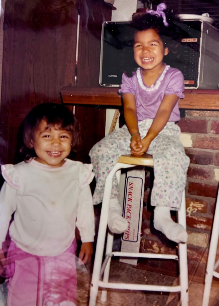 Two smiling young sisters indoors, a miracle discovery alive after 36 years of being reported missing.