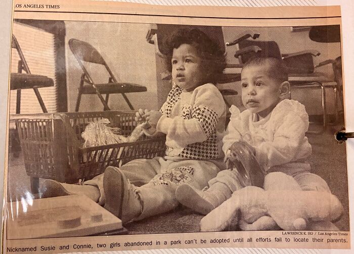 Vintage photo of young sisters sitting on the floor in a room, related to miracle sisters discovered alive after 36 years missing.