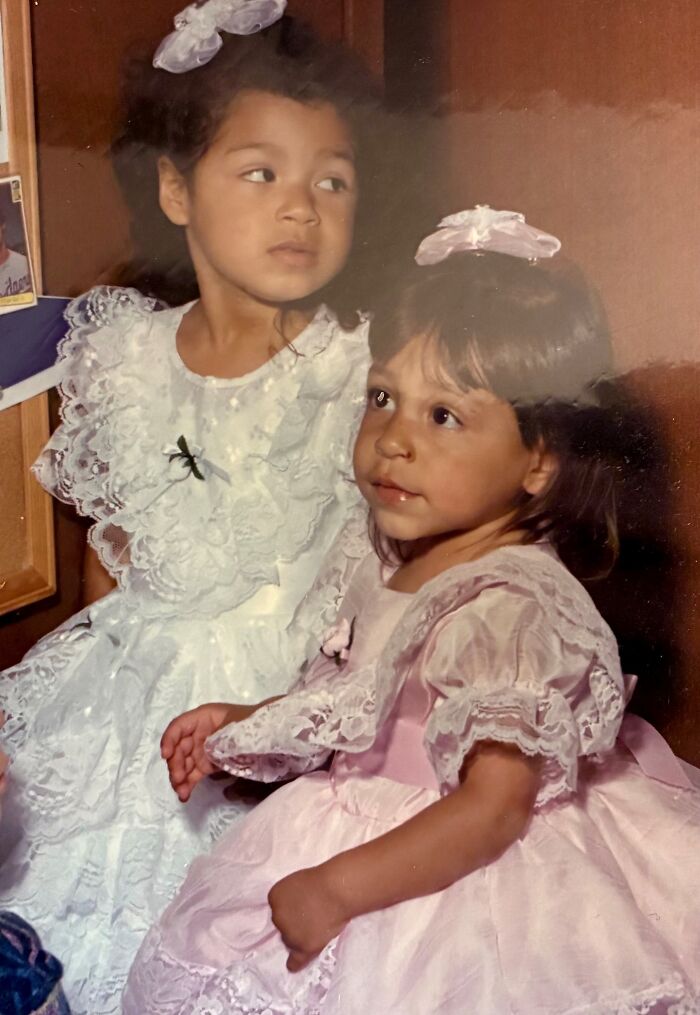 Two young sisters wearing lace dresses and hair bows, representing a miracle of being discovered alive after 36 years missing.
