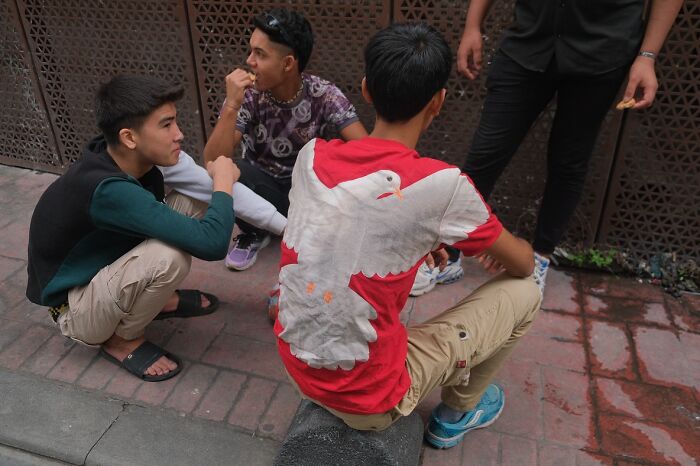Young men gathered on Istanbul streets, representing everyday life in the city’s vibrant urban culture.