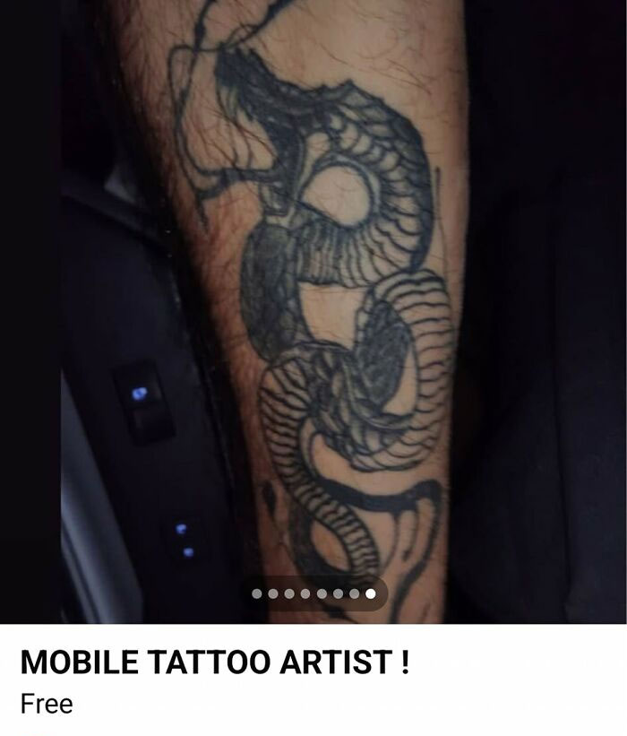 Black ink snake tattoo with bold lines on a person's forearm, showing one of the 91 tattoos people allowed on their bodies.