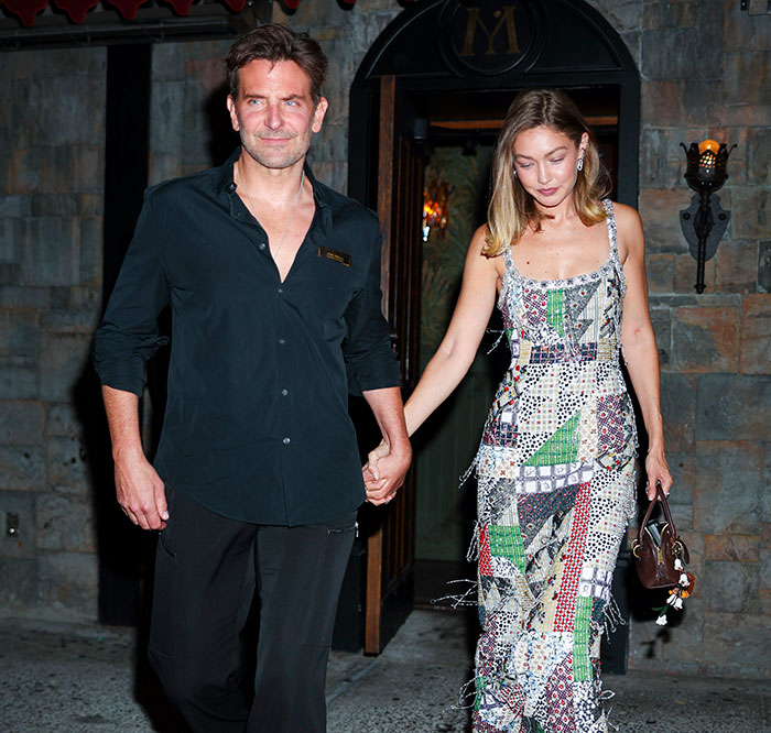 Bradley Cooper and a woman holding hands, with plastic surgeons commenting on his seemingly new look. Bradley Cooper and a woman holding hands, with plastic surgeons commenting on his seemingly new look.