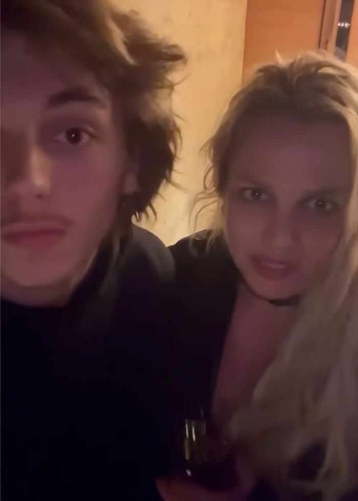 Britney Spears with bruises and a man in a dimly lit room, making a concerning claim about a horrible accident.