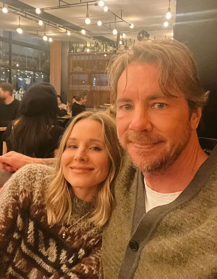 Kristen Bell and Dax Shepard smiling together in a cozy setting amid discussions of tone-deaf anniversary post controversy. Kristen Bell and Dax Shepard smiling together in a cozy setting amid discussions of tone-deaf anniversary post controversy.