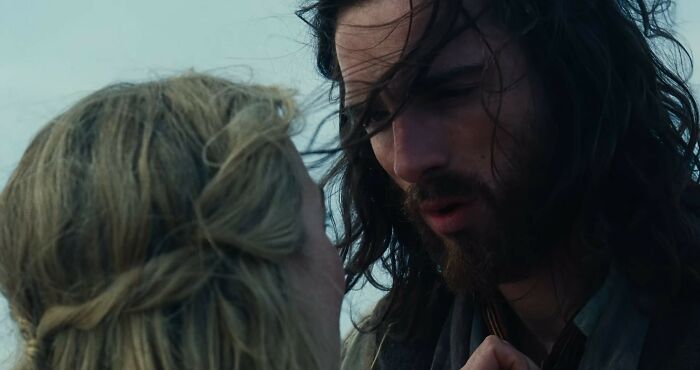Close-up of Margot Robbie and co-star in Wuthering Heights trailer scene, highlighting provocative and dramatic emotions.