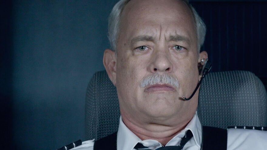 Actor Tom Hanks portraying a pilot in a dramatic scene from a movie based on true stories that feel impossible to believe.