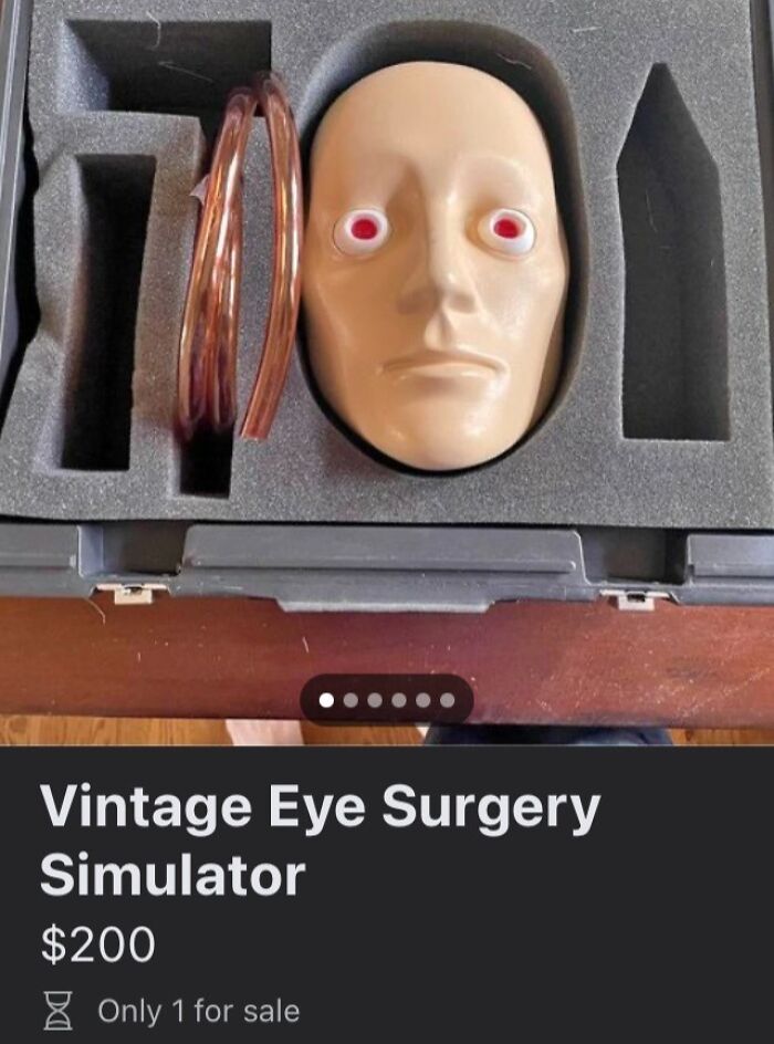 Vintage eye surgery simulator with red eyes in foam case, an unhinged thing people thought they could sell online.