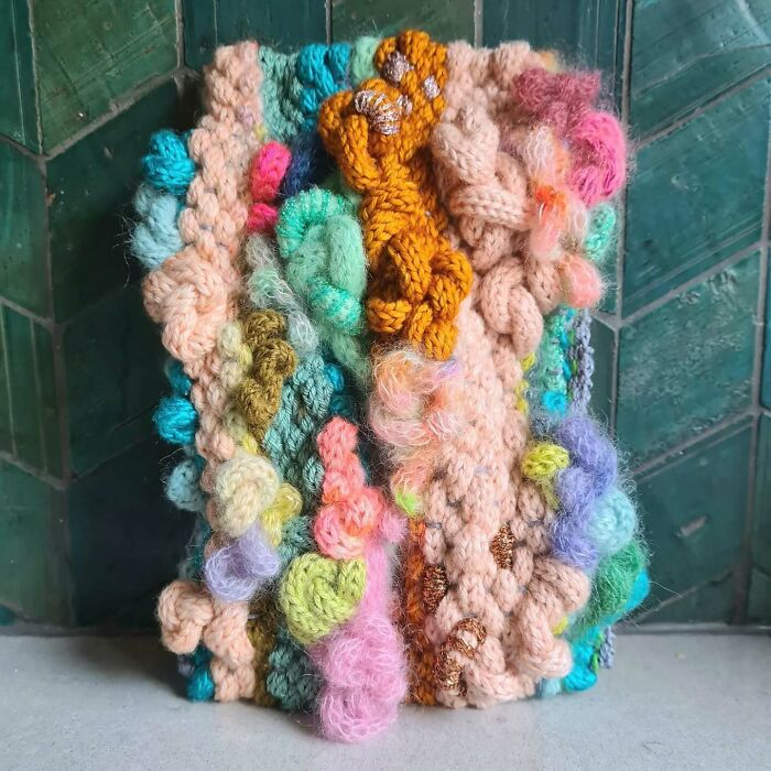 Colorful and textured textile creation showcasing threads turned into magic in an intricate, handcrafted design.