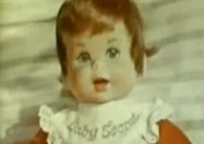 Creepy vintage doll from commercials with unsettling expression, evoking eerie and nightmare-inducing feelings.