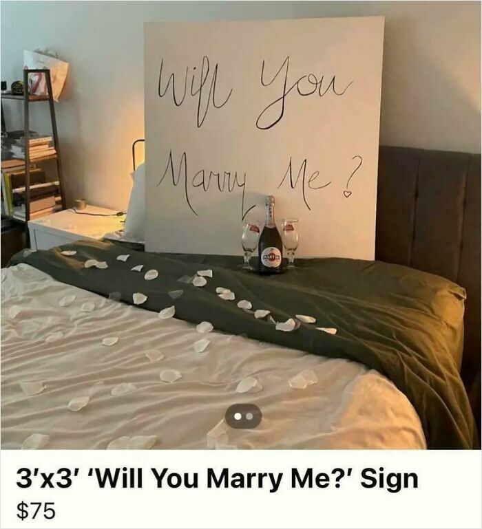 3x3 marriage proposal sign on bed with rose petals and drinks, an unhinged thing people thought they could sell online.