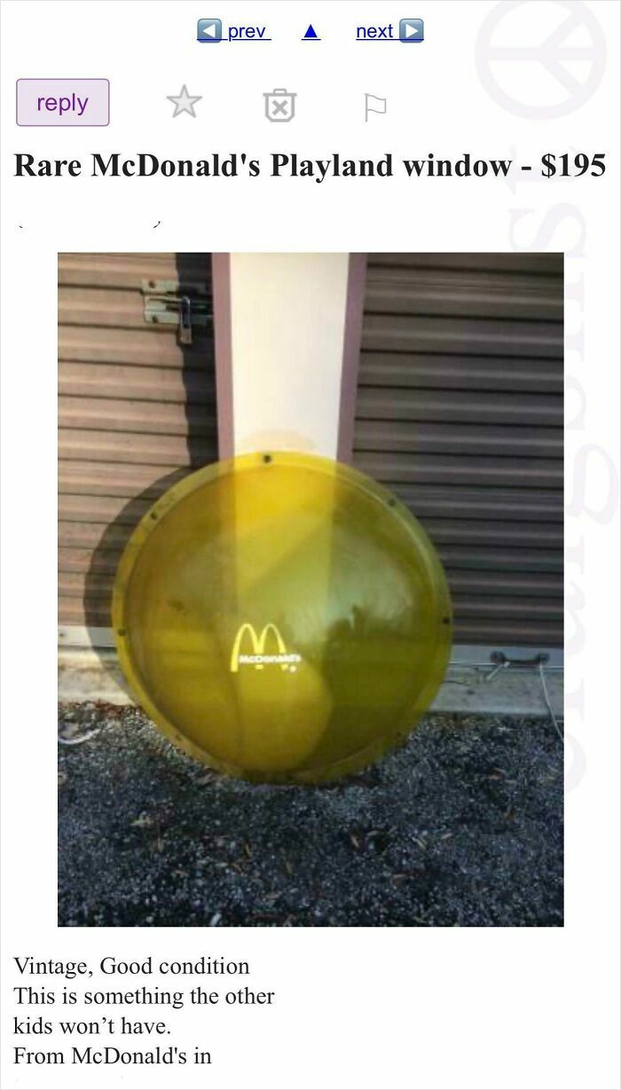 Yellow McDonald's Playland window listed for sale online as a rare vintage item in good condition outdoors by storage units.