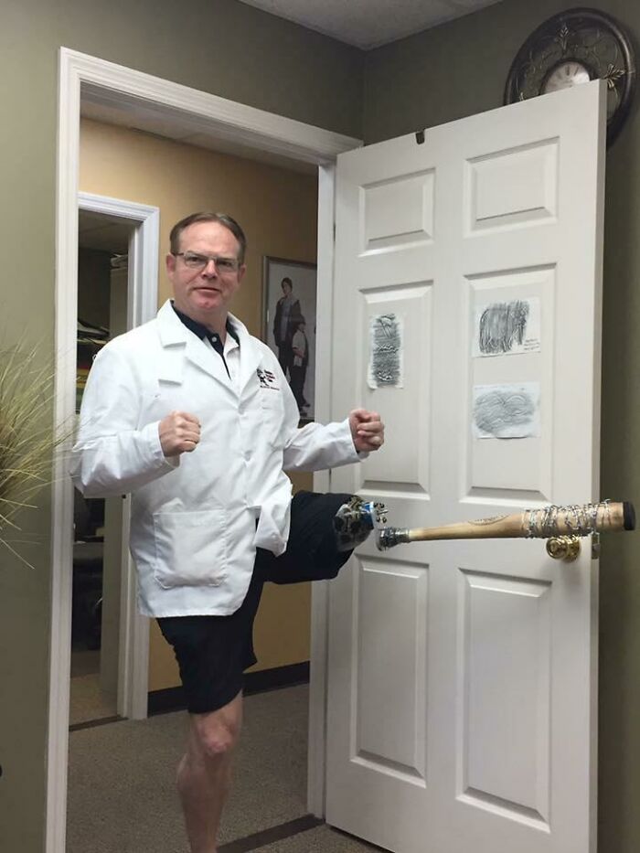 Doctor with prosthetic leg posing confidently with a baseball bat through a door, showcasing hilarious and wholesome patient care.