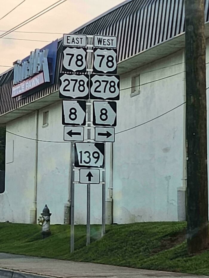 Confusing road signs showing multiple directions for routes 78, 278, 8, and 139, making navigation unclear.