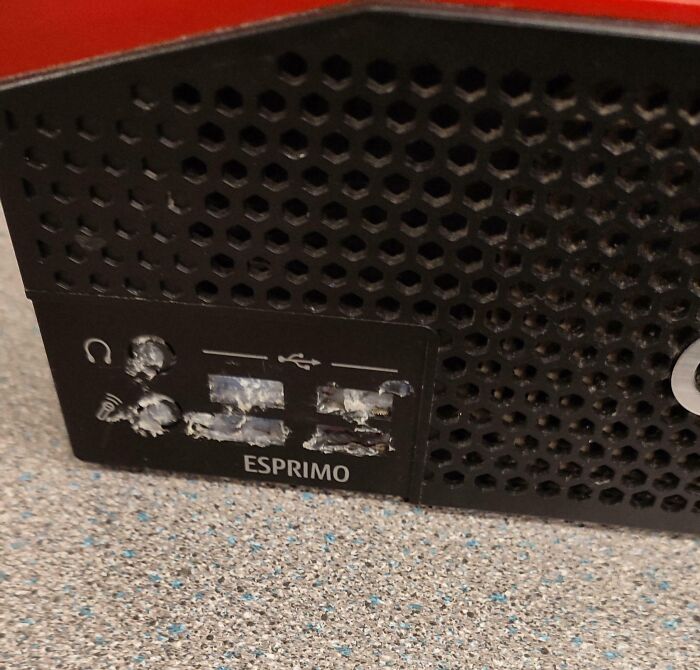 Damaged computer ports with corrosion and burn marks showing improper handling of electronics and soldering attempts.