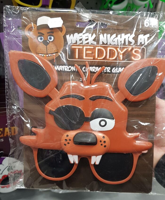 Off-brand Halloween costume glasses featuring a cartoonish fox character with mismatched eyes and large ears.