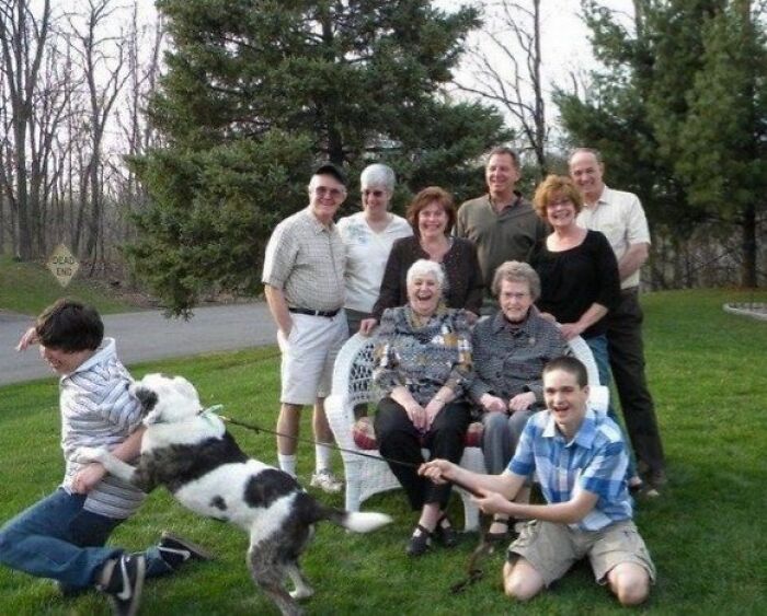 Family photo with dog causing chaos and laughter, a memorable moment from funny family photos shared online.