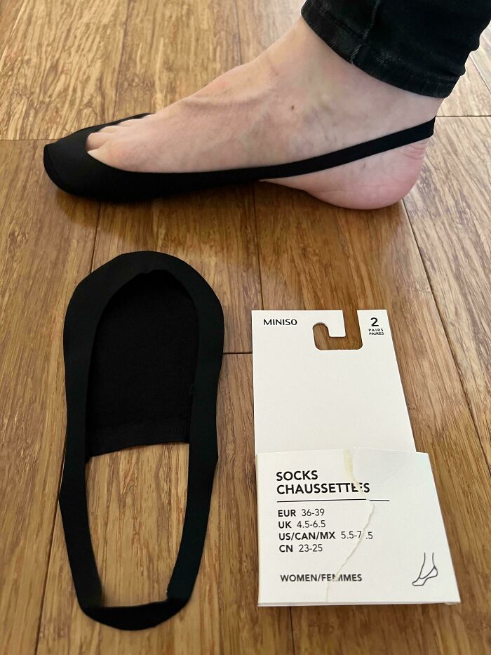 Black no-show socks that don’t fit properly on foot, illustrating mildly infuriating things that tested patience.
