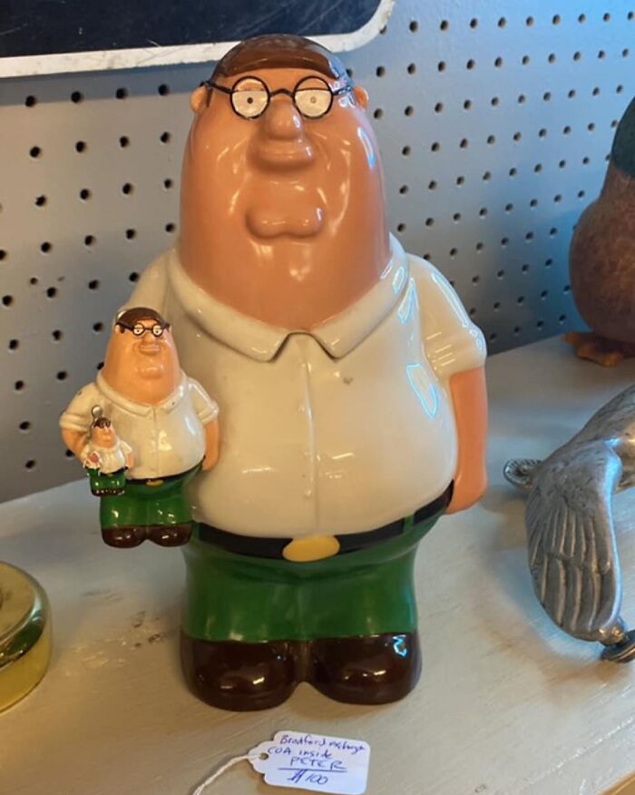 Ceramic figurine of Peter Griffin holding a smaller version, one of the weirdest purchases people would make.