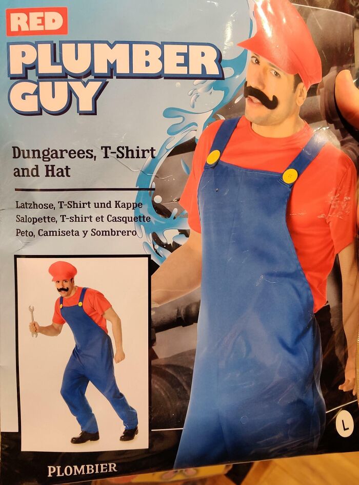 Off-brand Halloween costume of a plumber guy wearing blue dungarees, red T-shirt, and hat with a fake mustache.