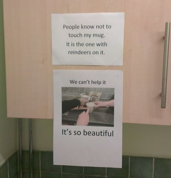Passive-aggressive coworker notes posted on a kitchen cabinet warning not to touch a specific mug with humor.
