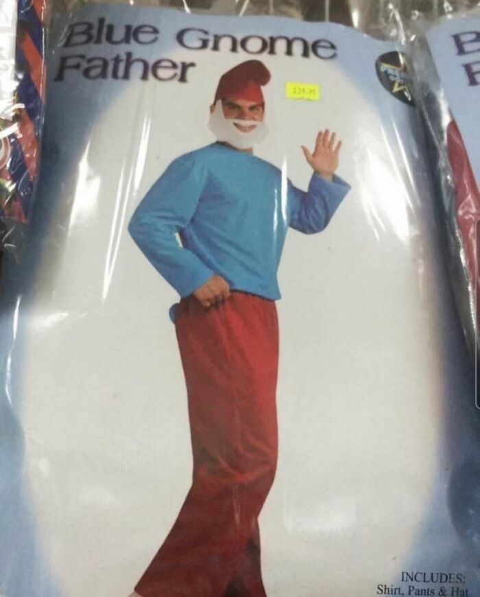 Man wearing off-brand Blue Gnome Father Halloween costume with red pants, blue shirt, white beard, and pointed red hat.