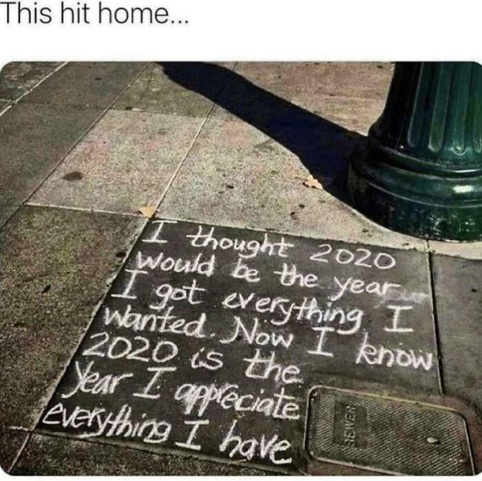 Chalk message on sidewalk reflecting on appreciating what you have in 2020, illustrating simple living mindset outdoors.