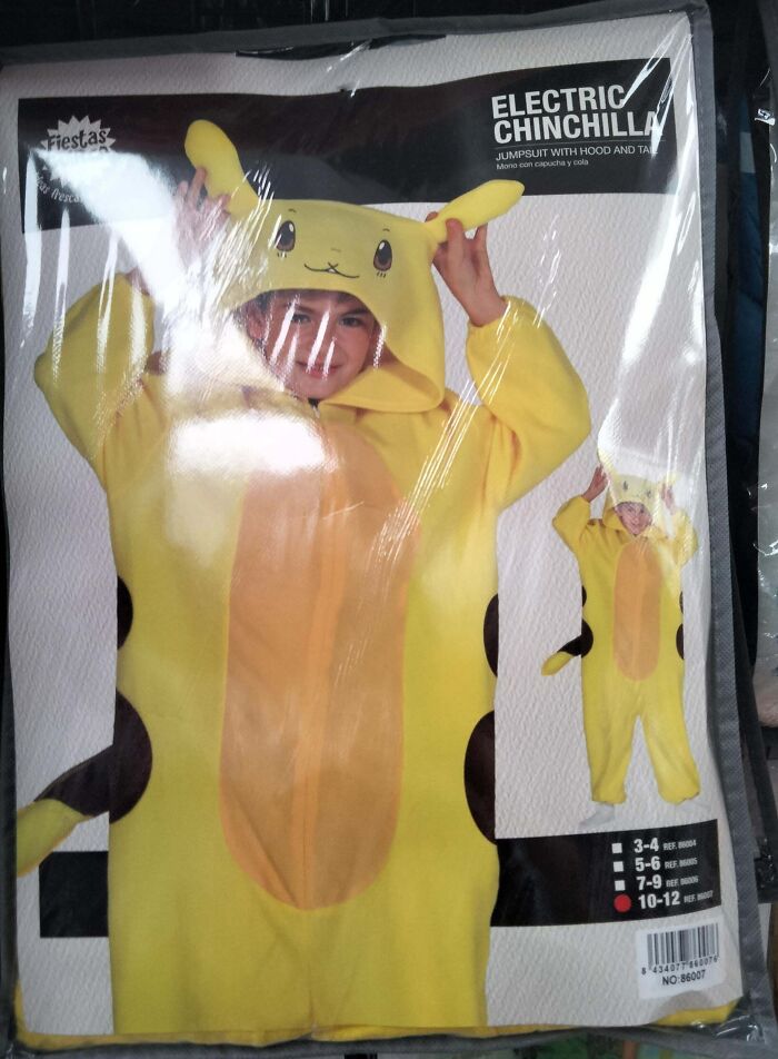 Child wearing a yellow off-brand Halloween costume resembling a cartoon animal with ears and a tail.