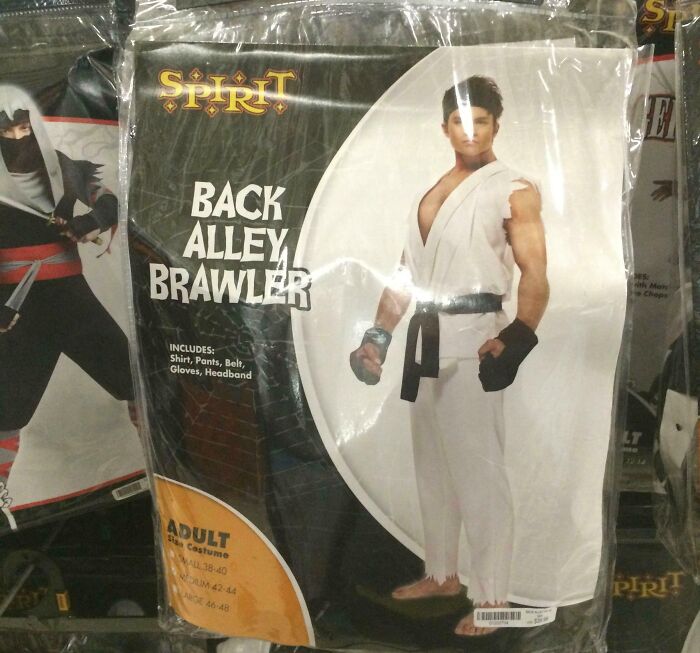 Off-brand Halloween costume called Back Alley Brawler with shirt, pants, belt, gloves, and headband in packaging.