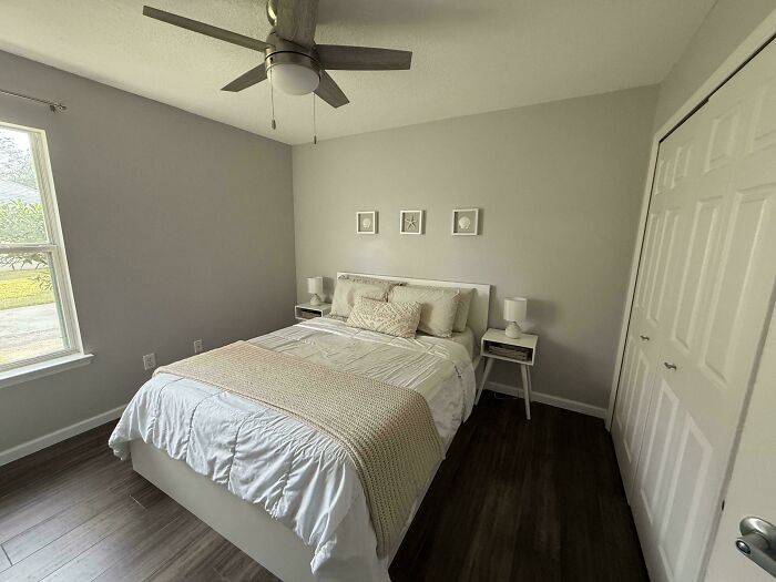 Minimalist bedroom with simple living decor, neutral tones, and natural light emphasizing a clutter-free space.