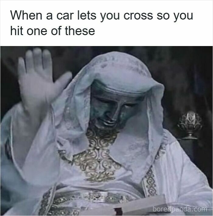 Statue with raised hand symbolizing awkward moments when a car lets you cross, a specific moment in our lives.