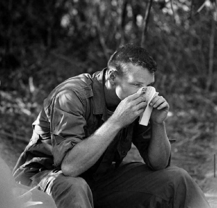 Soldier using a map outdoors, captured in a fascinating photo revealing unique facts and stories to see the world differently.