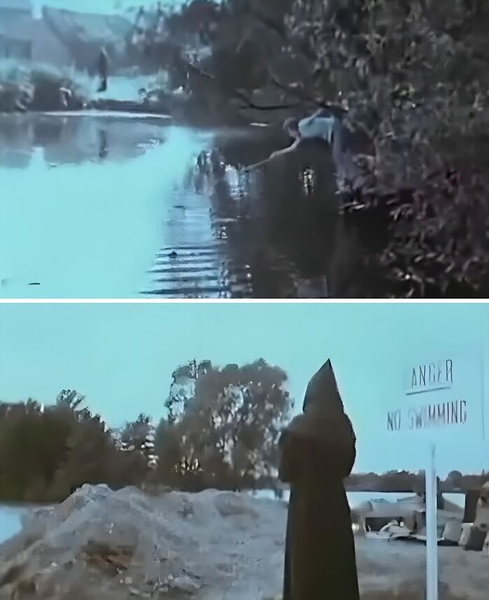 Person leaning over water by trees above, and a figure in a dark cloak near a no swimming sign by a riverside.